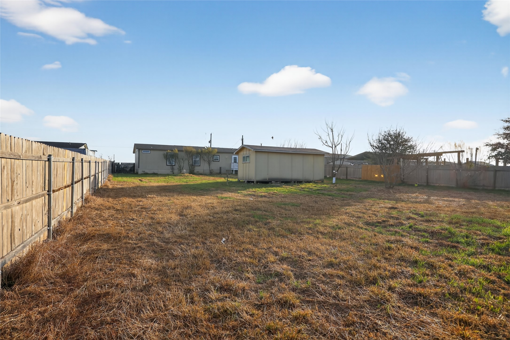 2674 Cotton Gin Road Kyle, TX 78640 - Photo 6 of 30 Back of property with a fenced backyard