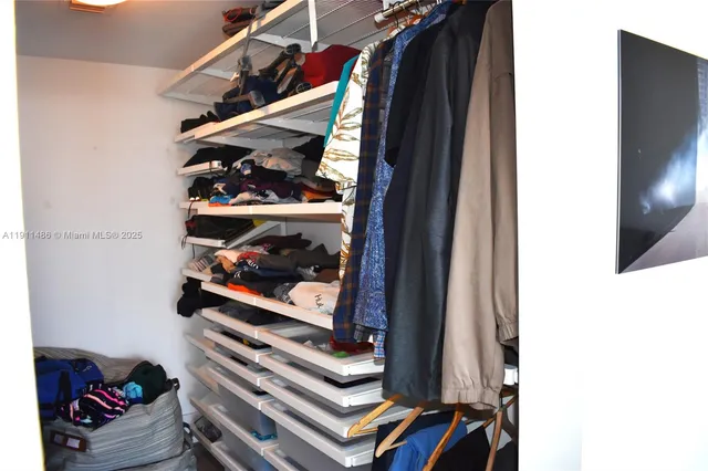 a bathroom with a double vanity sink toilet and shower