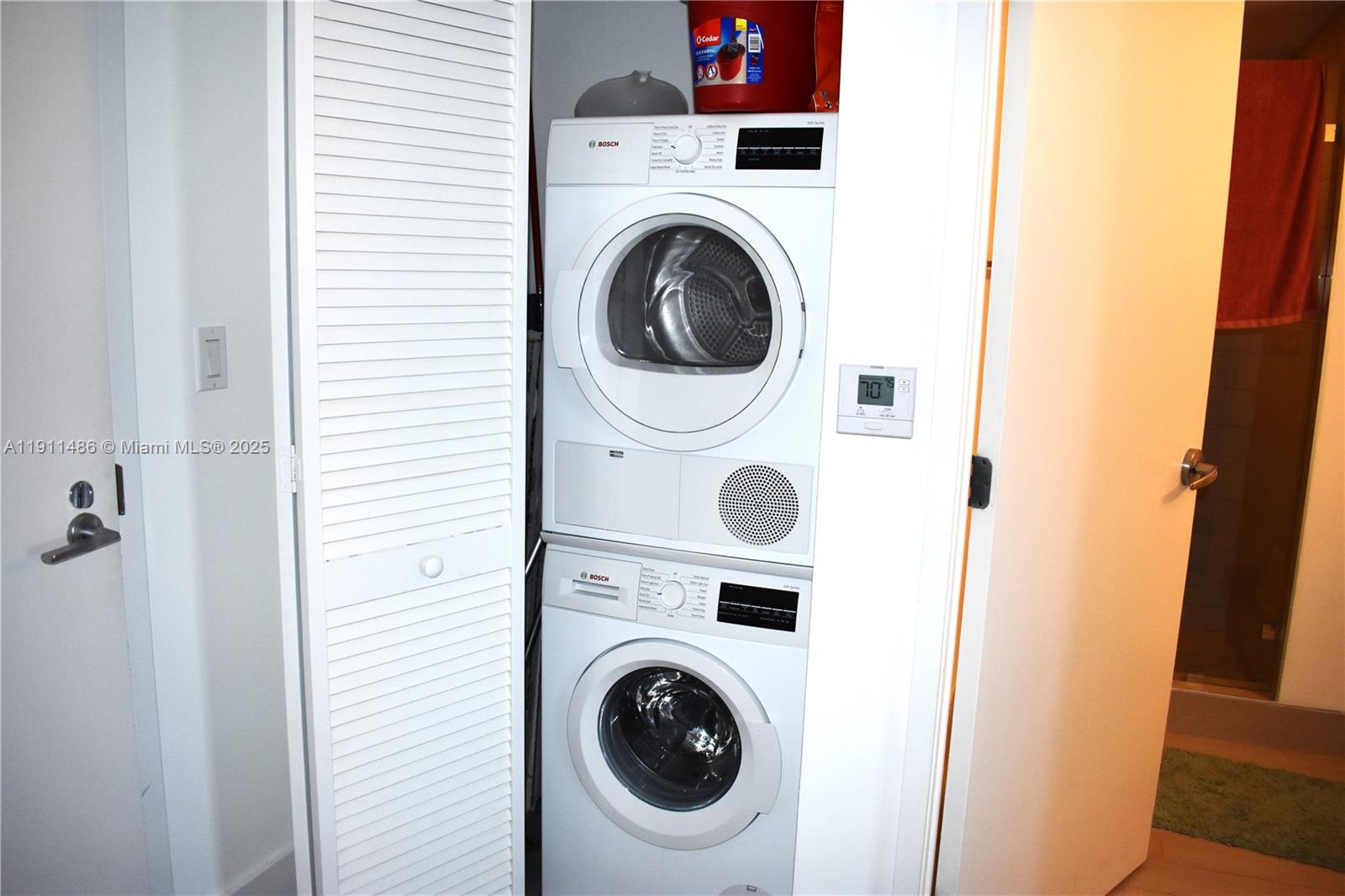 9940 West Bay Harbor Drive, Unit 6DN Bay Harbor Islands, FL 33154 - Photo 31 of 46 a utility room with dryer and washer