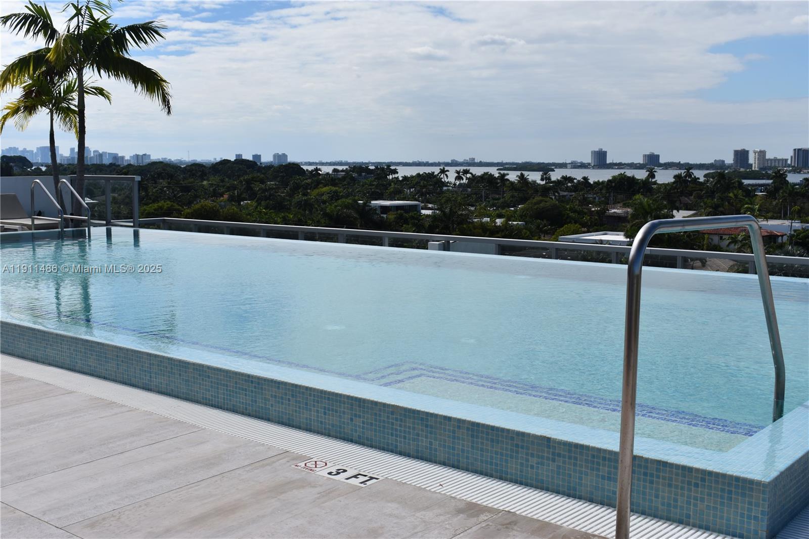 9940 West Bay Harbor Drive, Unit 6DN Bay Harbor Islands, FL 33154 - Photo 32 of 46 a view of a swimming pool with a table