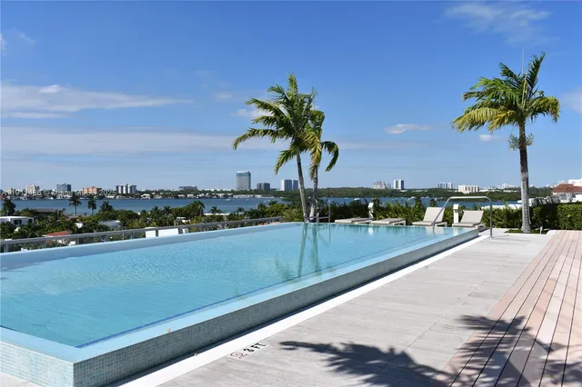 a view of a patio with couches and city view
