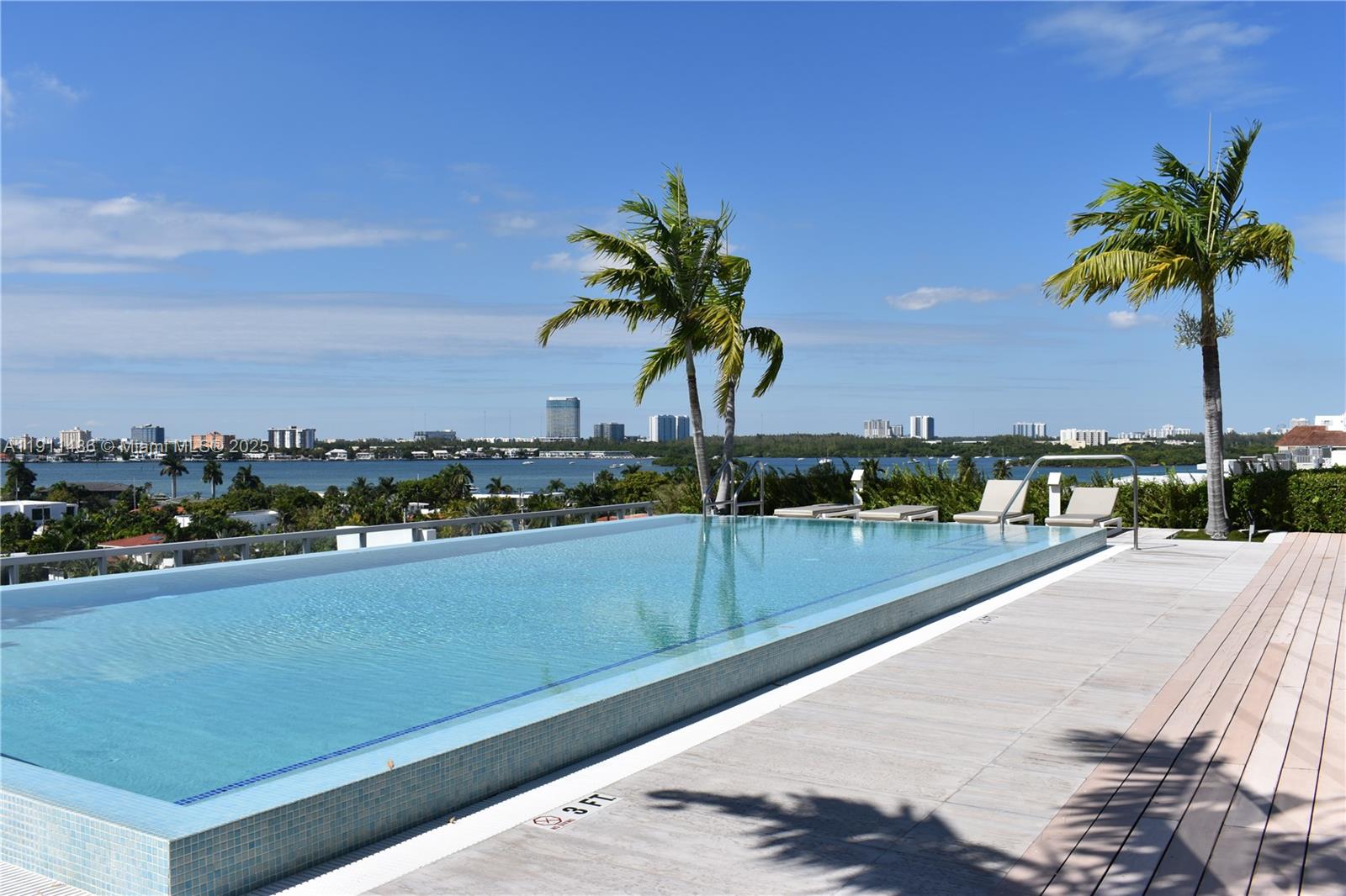 9940 West Bay Harbor Drive, Unit 6DN Bay Harbor Islands, FL 33154 - Photo 36 of 46 a view of a swimming pool and a chair