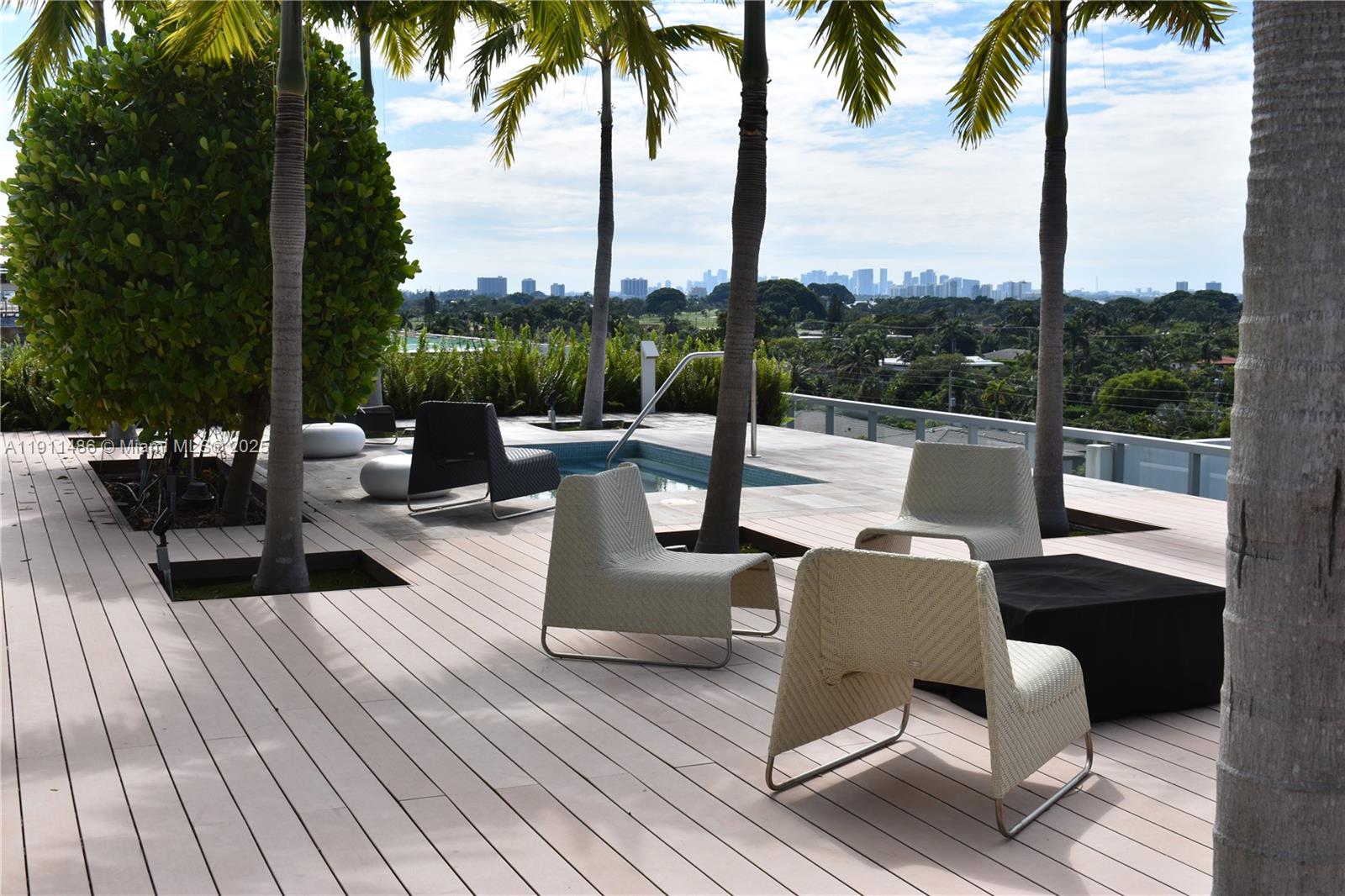 9940 West Bay Harbor Drive, Unit 6DN Bay Harbor Islands, FL 33154 - Photo 37 of 46 a view of a patio with couches and city view