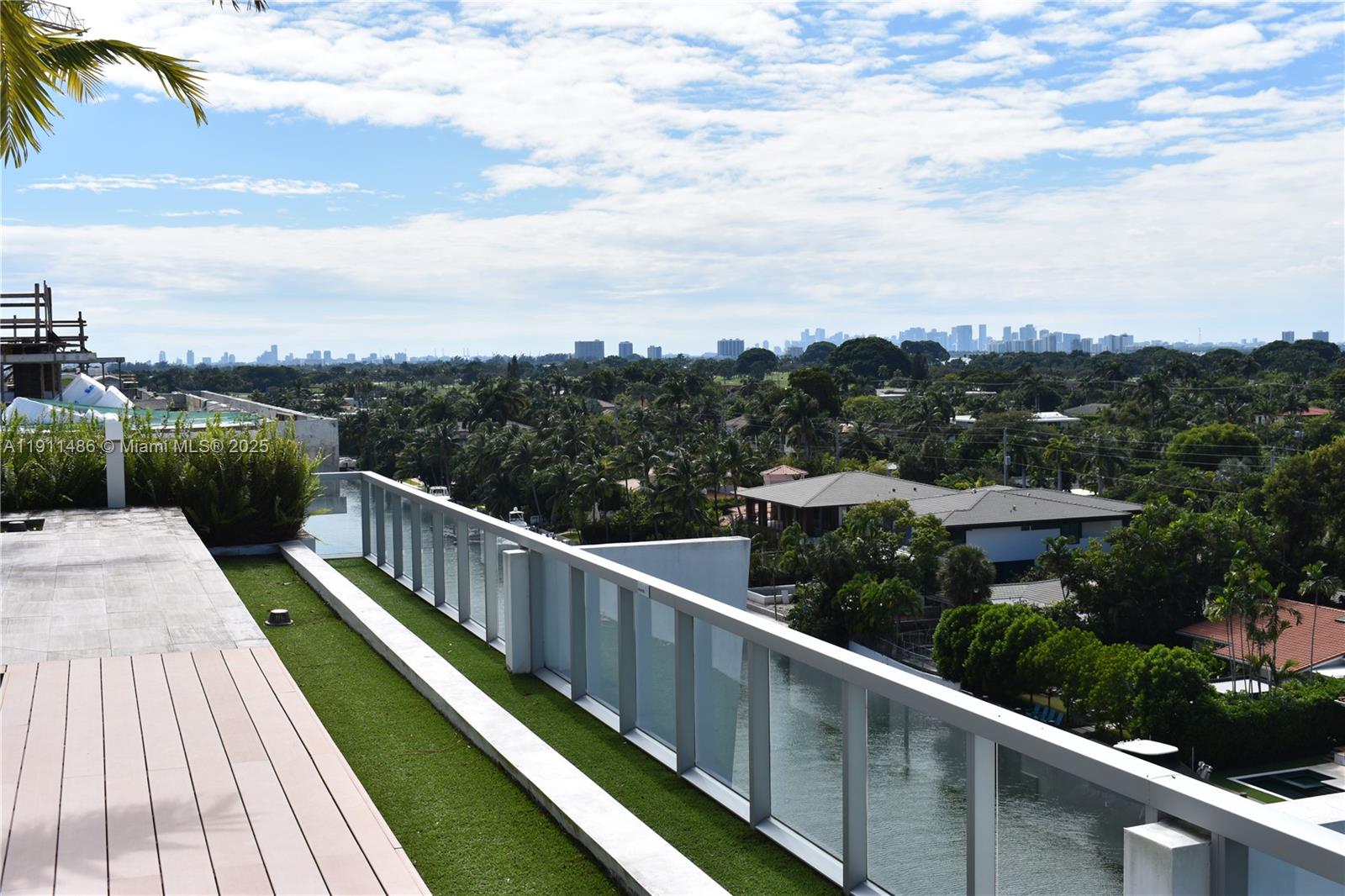 9940 West Bay Harbor Drive, Unit 6DN Bay Harbor Islands, FL 33154 - Photo 39 of 46 a view of a balcony with wooden floor and fence