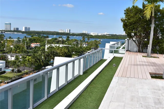 a outdoor dining space with furniture and wooden floor