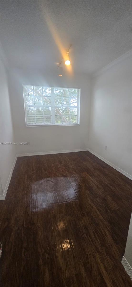 11630 Southwest 2nd Street, Unit 17208 Pembroke Pines, FL 33025 - Photo 13 of 32 a view of wooden floor and windows in a room
