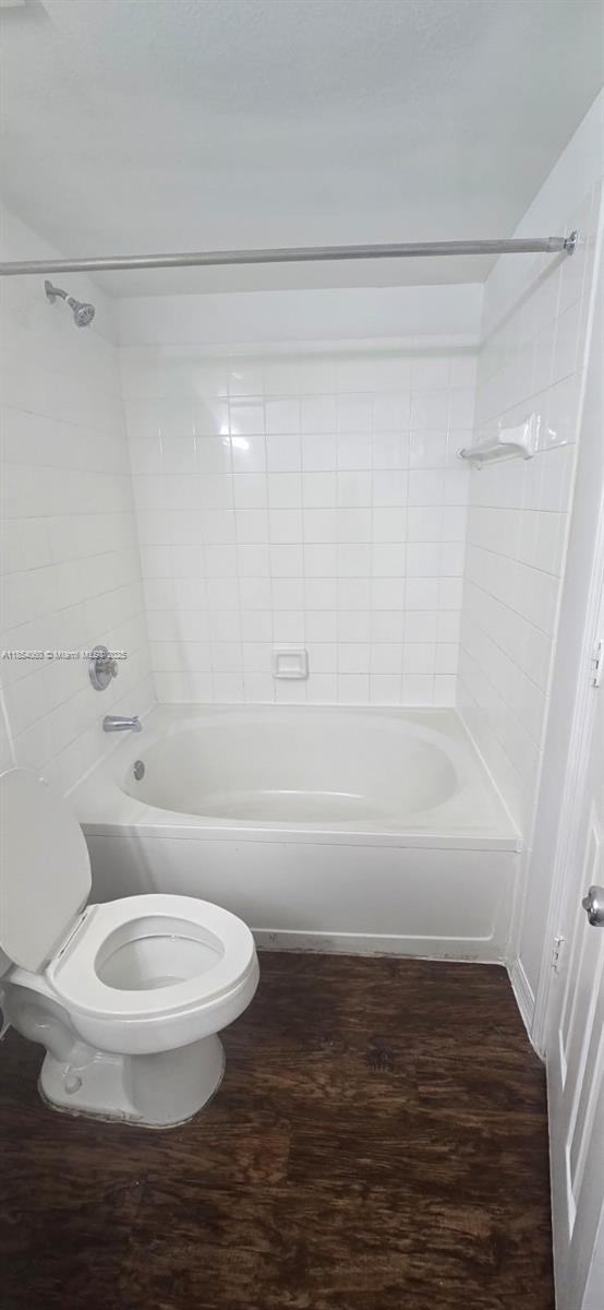 11630 Southwest 2nd Street, Unit 17208 Pembroke Pines, FL 33025 - Photo 18 of 32 a white toilet sitting next to a bath tub