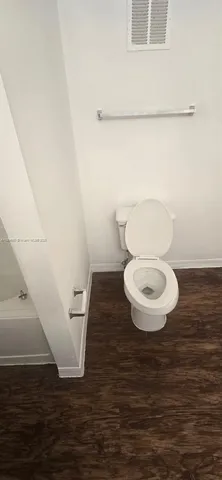 a bathroom with a toilet and a sink