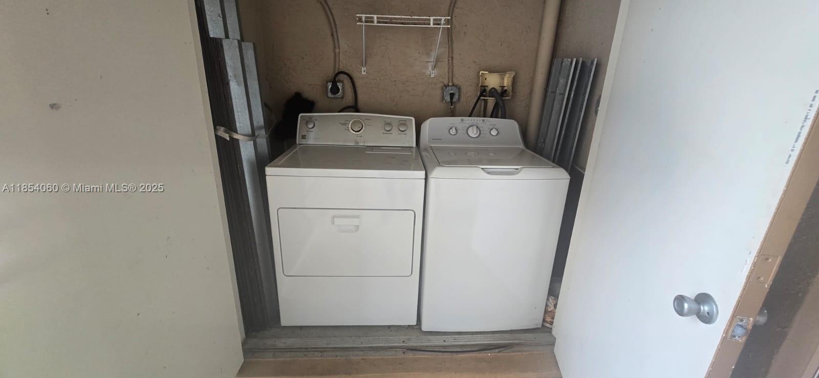 11630 Southwest 2nd Street, Unit 17208 Pembroke Pines, FL 33025 - Photo 22 of 32 a utility room with dryer and washer
