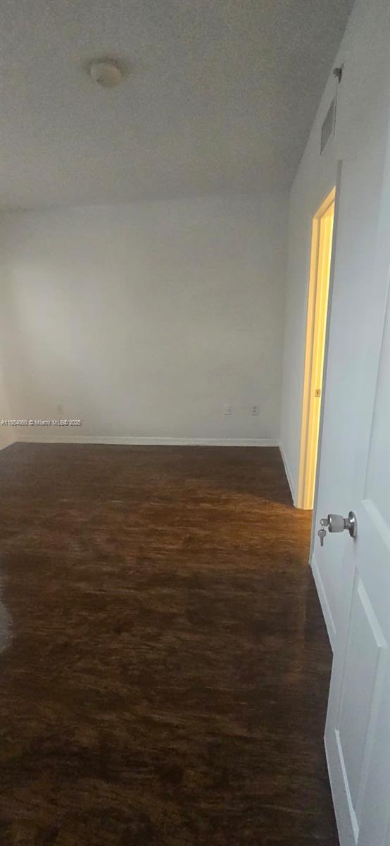 11630 Southwest 2nd Street, Unit 17208 Pembroke Pines, FL 33025 - Photo 23 of 32 a view of an empty room with a window