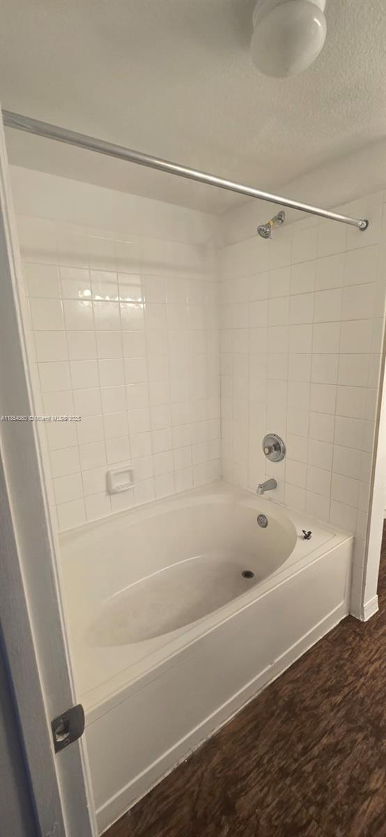 11630 Southwest 2nd Street, Unit 17208 Pembroke Pines, FL 33025 - Photo 29 of 32 a bathroom with a shower and a bath tub