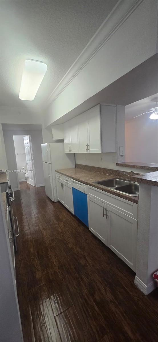 11630 Southwest 2nd Street, Unit 17208 Pembroke Pines, FL 33025 - Photo 32 of 32 a kitchen with granite countertop a stove and cabinets