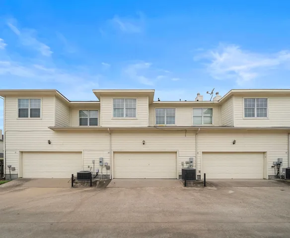 a view of a car park in front of house