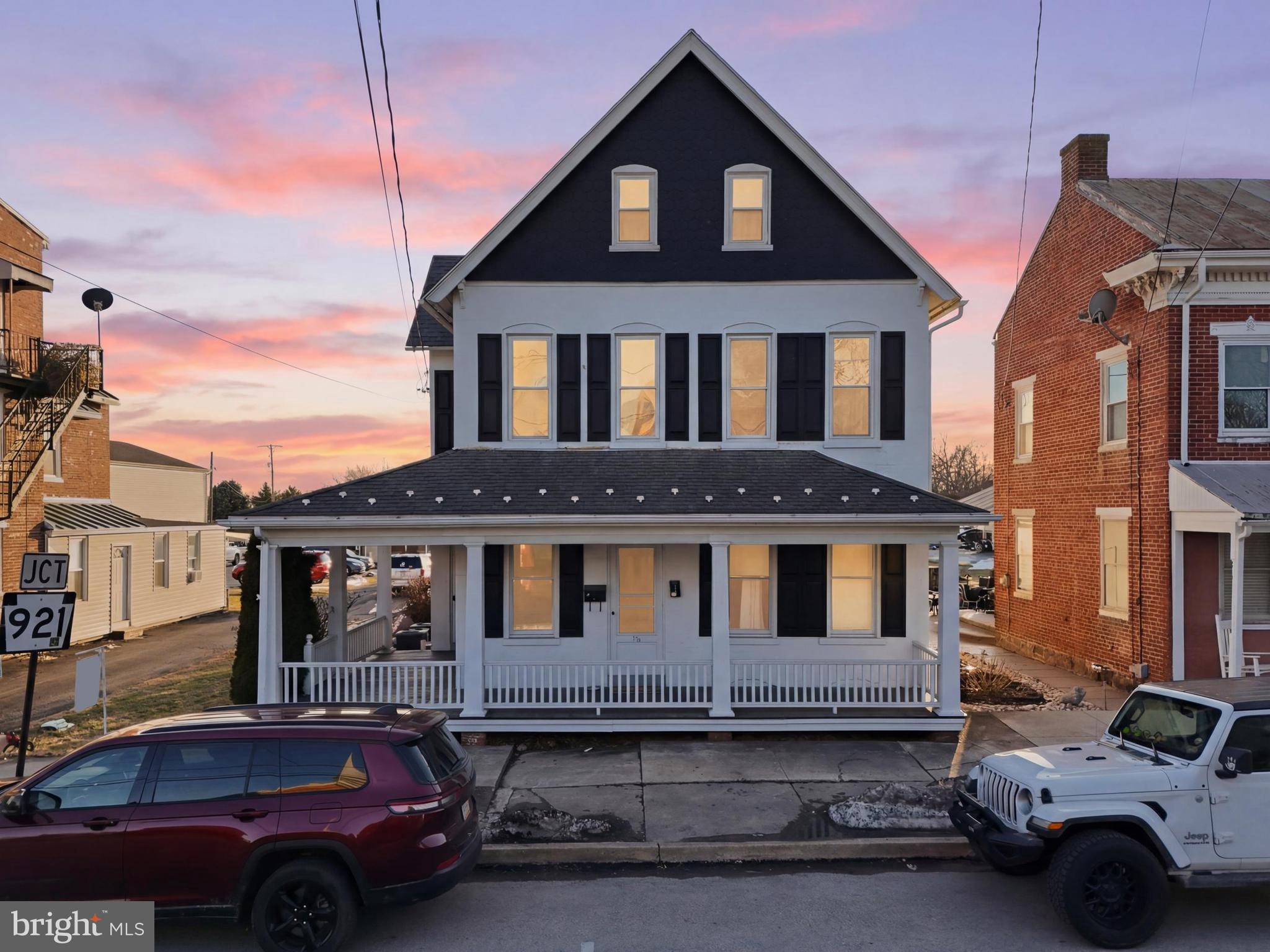a front view of a house with parking space