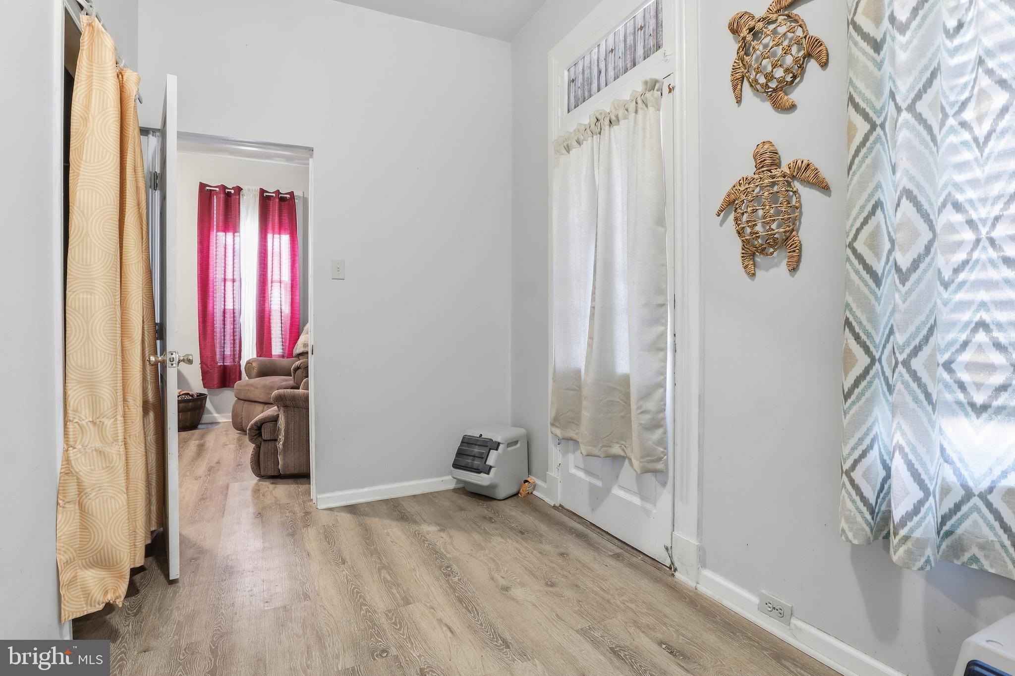 70 North Main Street Dover, PA 17315 - Photo 12 of 43 a view of livingroom with hardwood floor and hallway