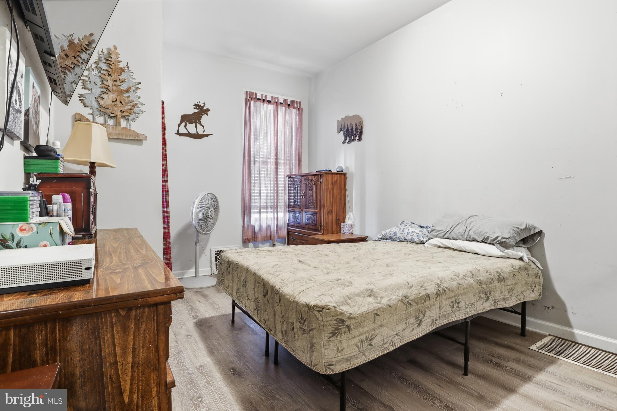 70 North Main Street Dover, PA 17315 - Photo 13 of 43 a bedroom with a bed and a table