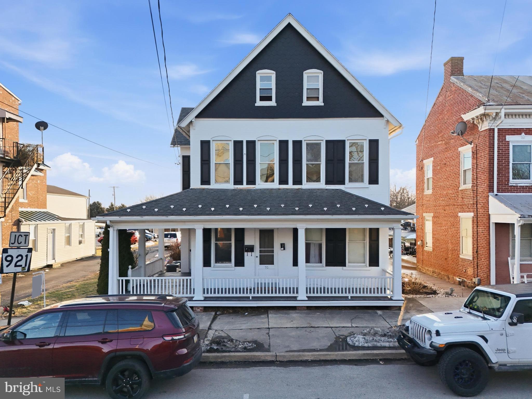 70 North Main Street Dover, PA 17315 - Photo 2 of 43 a front view of a house with parking space