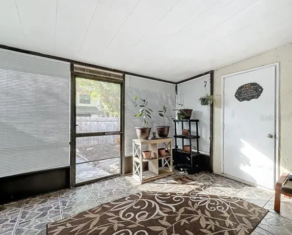 a view of a hallway with washer and dryer