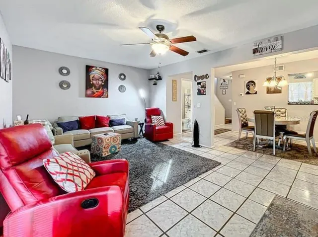 a living room with furniture and white walls