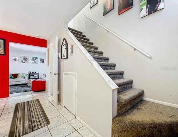 a view of entryway kitchen and hall kitchen