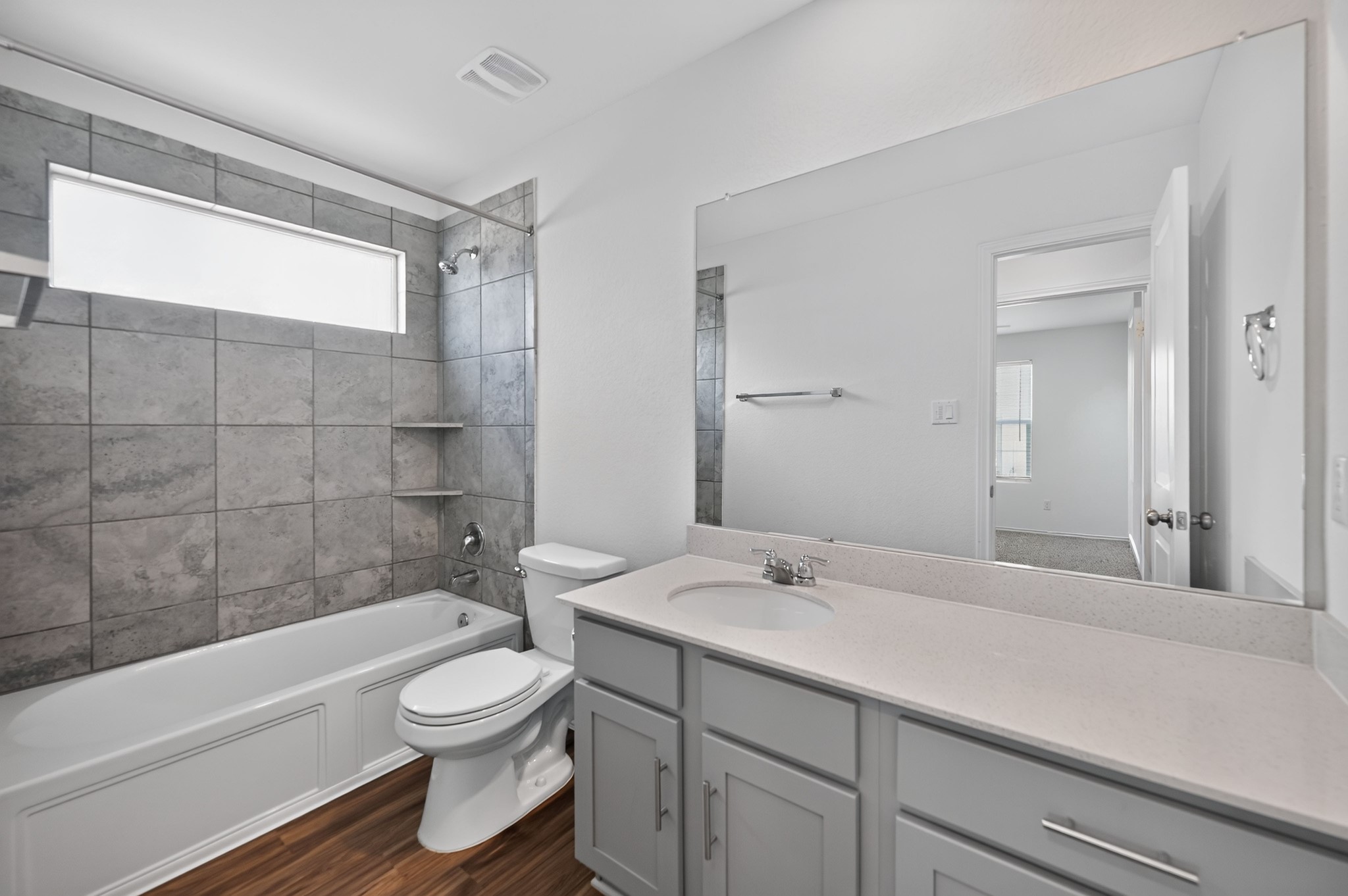 128 Konik Road Georgetown, TX 78626 - Photo 21 of 34 Modern bath features a pristine vanity, sleek tiling, and durable flooring.