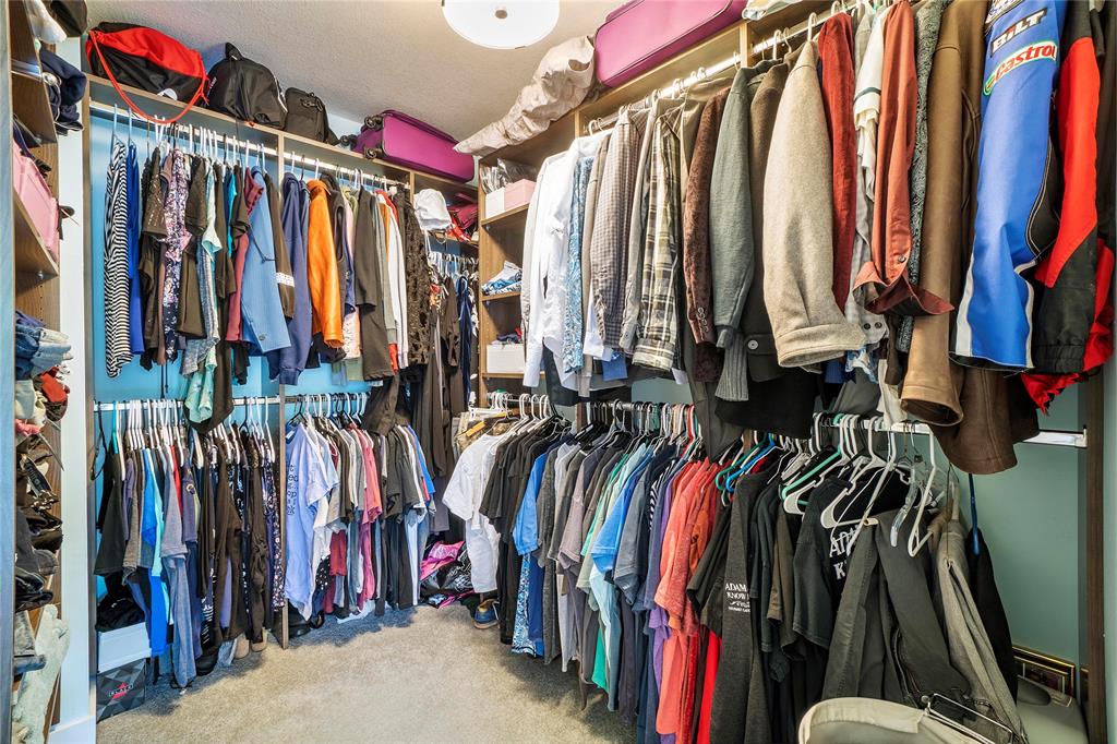 3908 South Ocean Boulevard, Unit TH4 Boca Raton, FL 33487 - Photo 18 of 37 a view of walk in closet with clothes