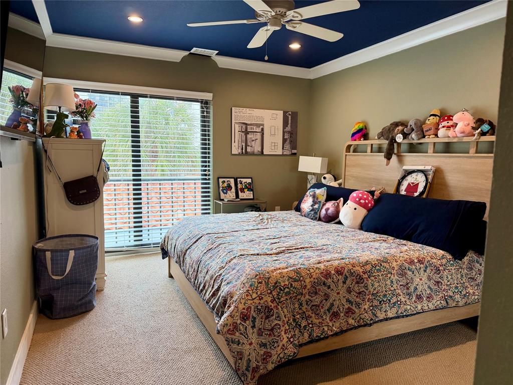 3908 South Ocean Boulevard, Unit TH4 Boca Raton, FL 33487 - Photo 20 of 37 a bed room with a bed and a ceiling fan