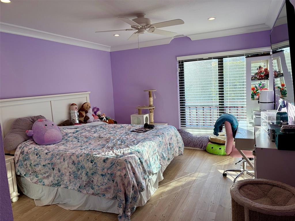 3908 South Ocean Boulevard, Unit TH4 Boca Raton, FL 33487 - Photo 22 of 37 a bedroom with a bed a table and potted plants