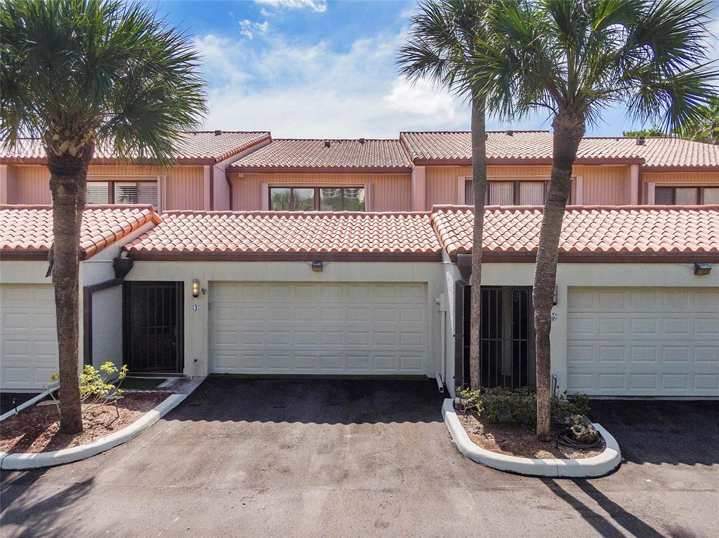 3908 South Ocean Boulevard, Unit TH4 Boca Raton, FL 33487 - Photo 32 of 37 a front view of a house