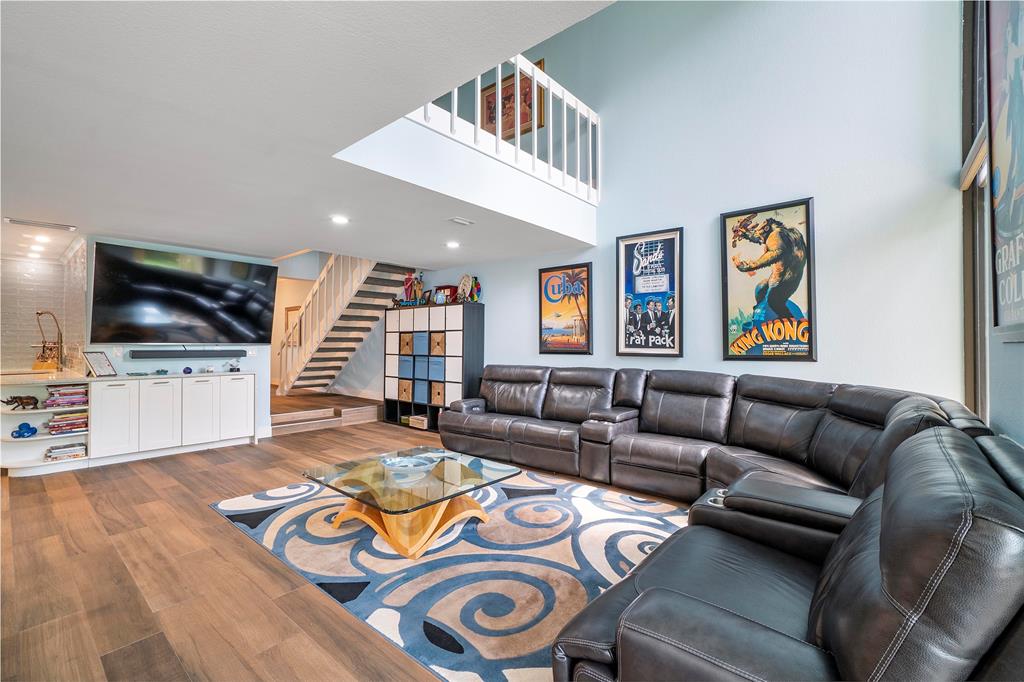 3908 South Ocean Boulevard, Unit TH4 Boca Raton, FL 33487 - Photo 6 of 37 a living room with furniture and a flat screen tv