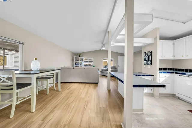a kitchen with granite countertop a sink and a stove top oven
