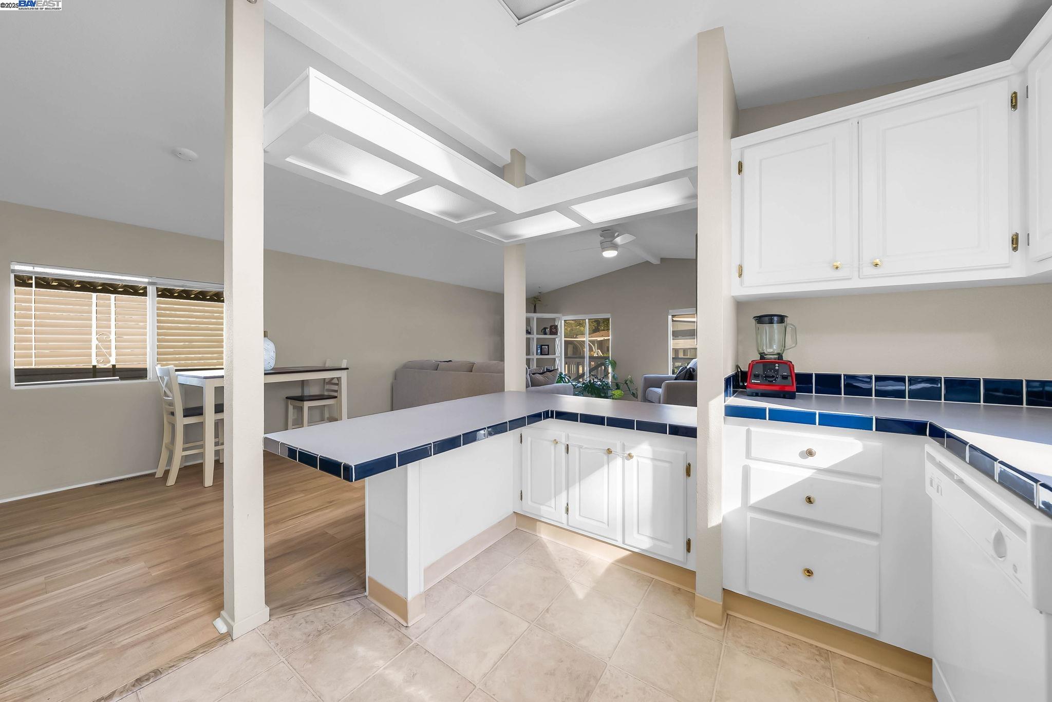 711 Old Canyon Road, Unit 176 Fremont, CA 94536 - Photo 18 of 41 a kitchen with granite countertop white cabinets and white appliances