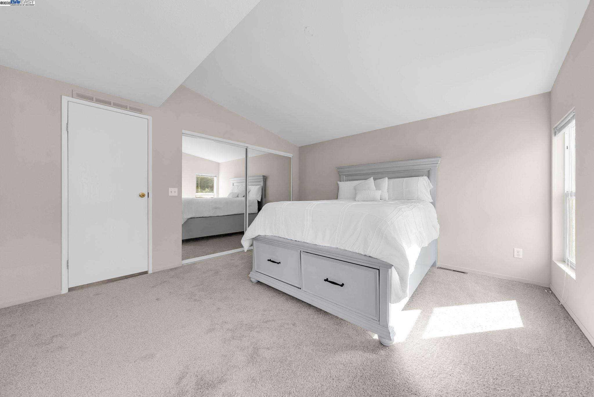 711 Old Canyon Road, Unit 176 Fremont, CA 94536 - Photo 20 of 41 a spacious bedroom with a bed and a window