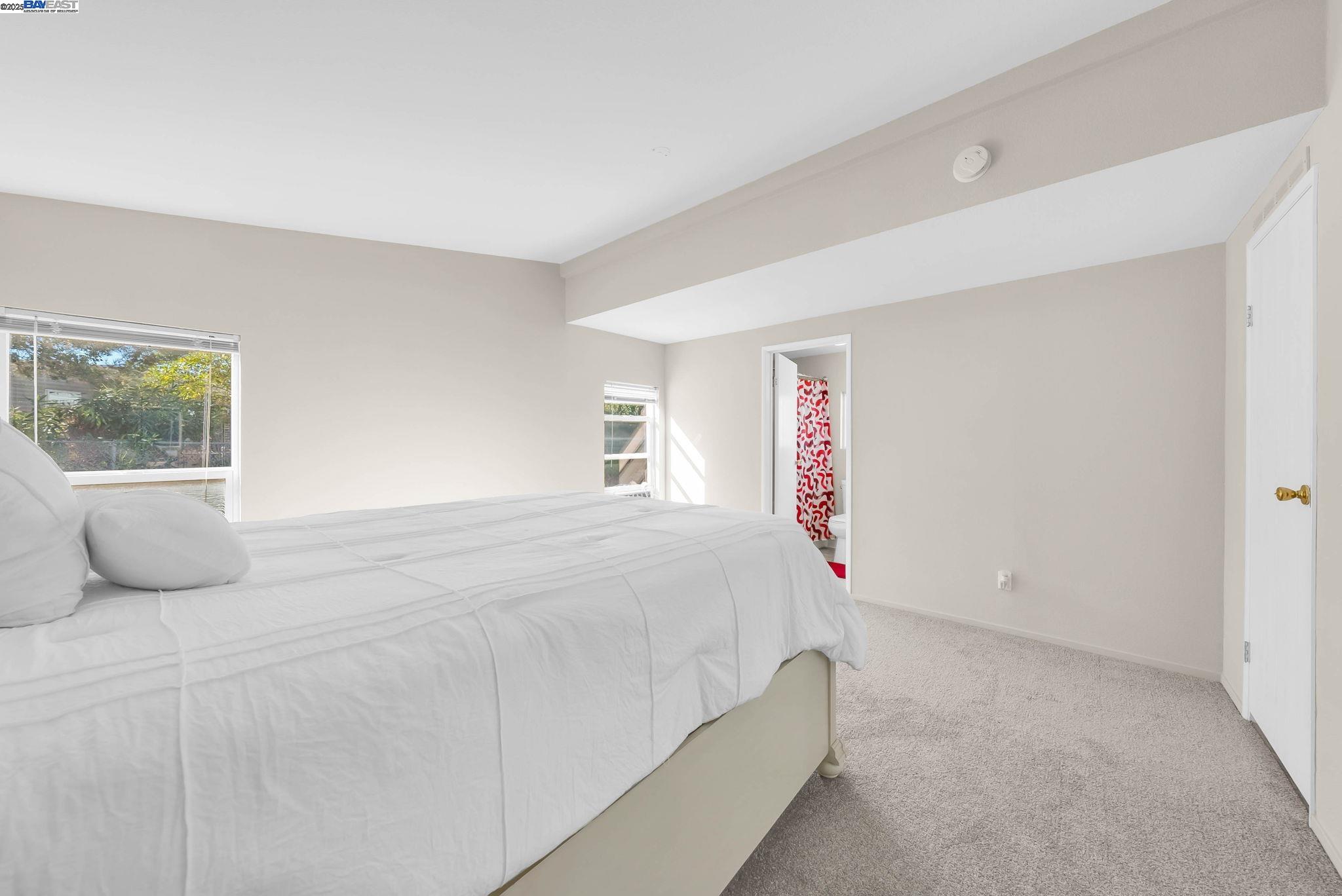 711 Old Canyon Road, Unit 176 Fremont, CA 94536 - Photo 21 of 41 a bedroom with a bed and a window