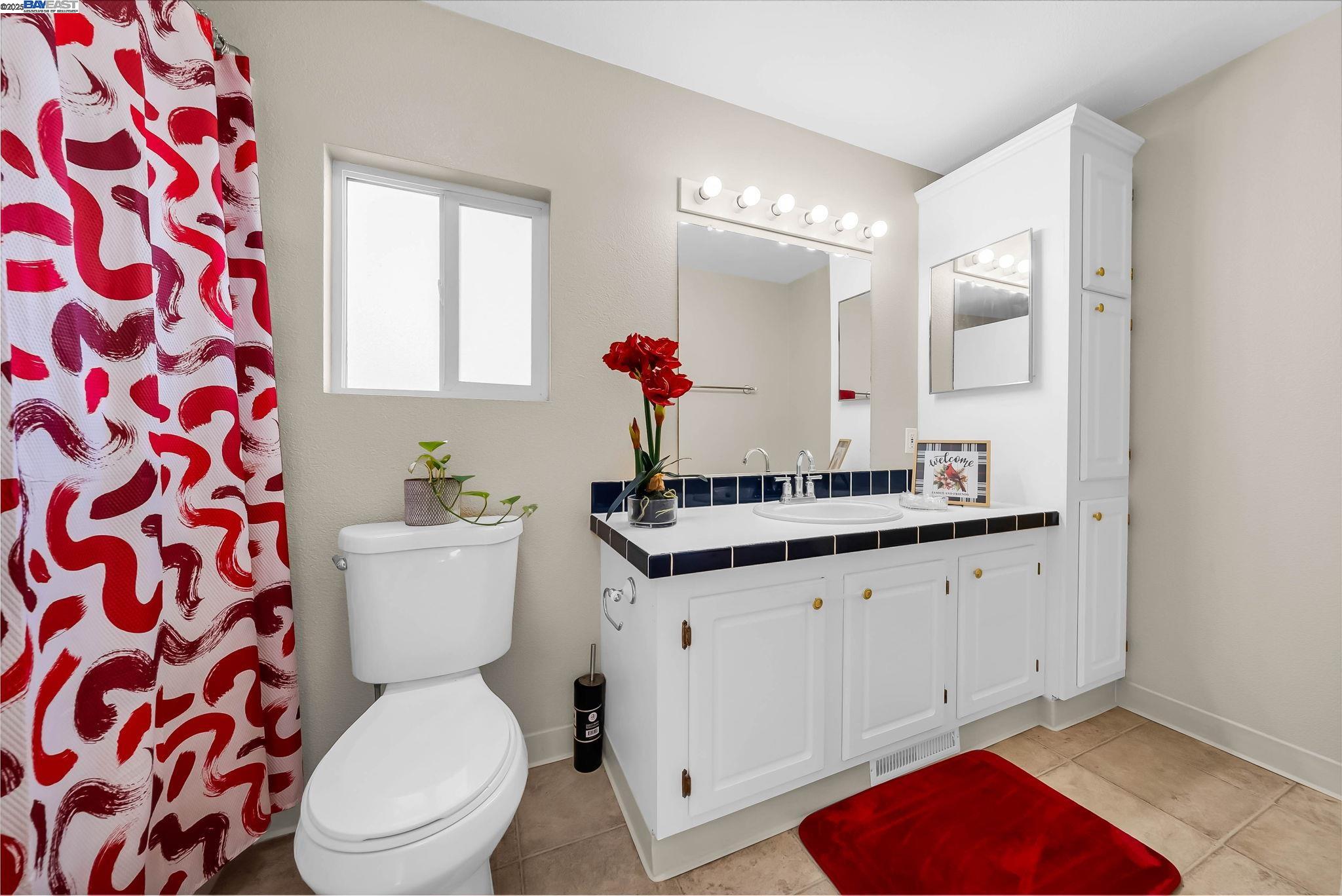 711 Old Canyon Road, Unit 176 Fremont, CA 94536 - Photo 22 of 41 a bathroom with a toilet sink and mirror