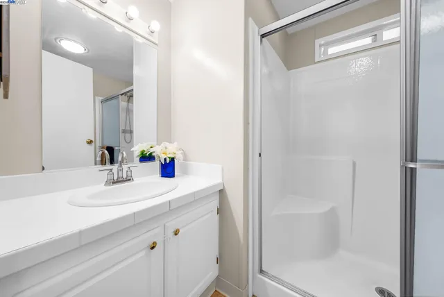 a white toilet sitting next to a bathroom sink
