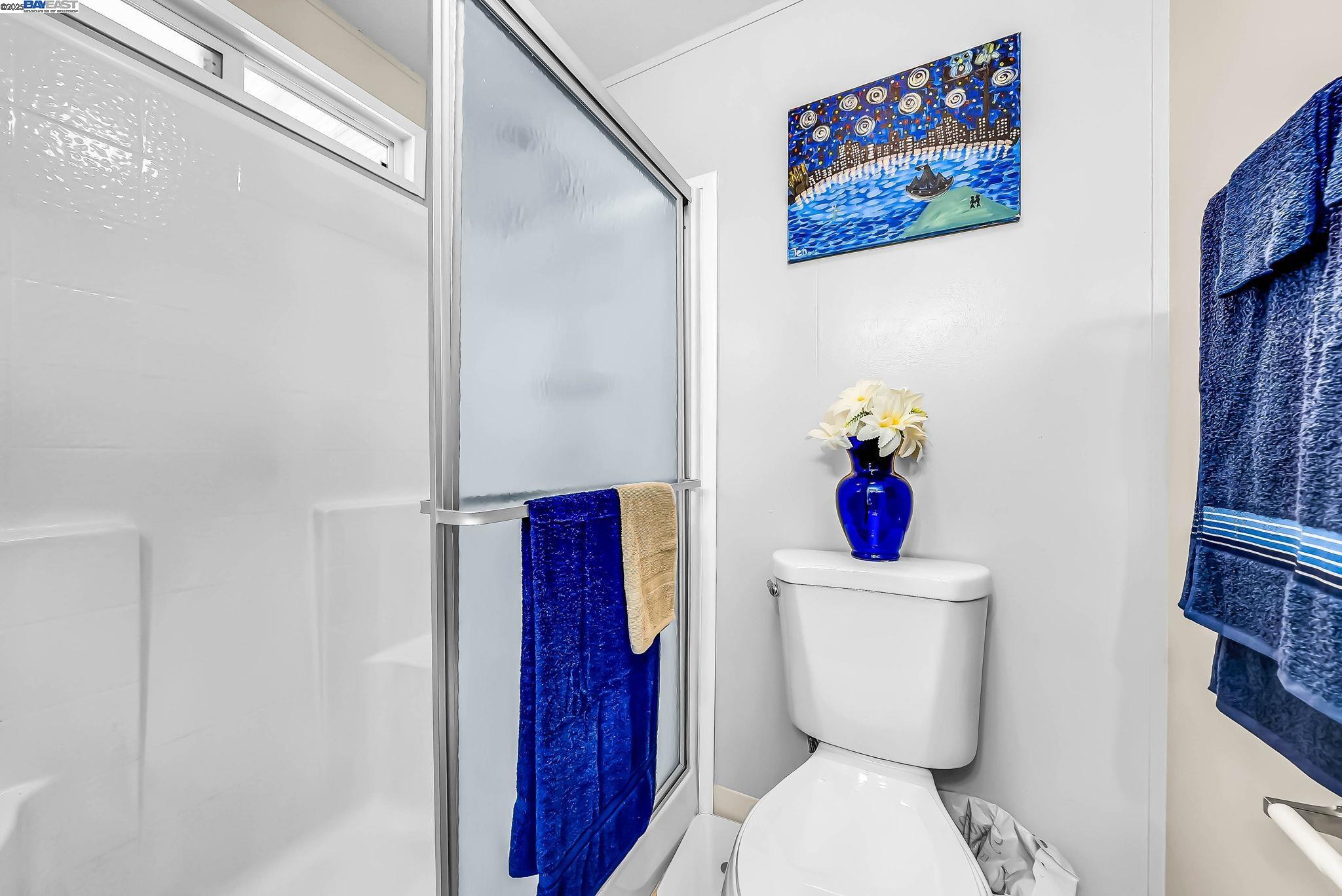 711 Old Canyon Road, Unit 176 Fremont, CA 94536 - Photo 28 of 41 a white toilet sitting next to a bathroom sink