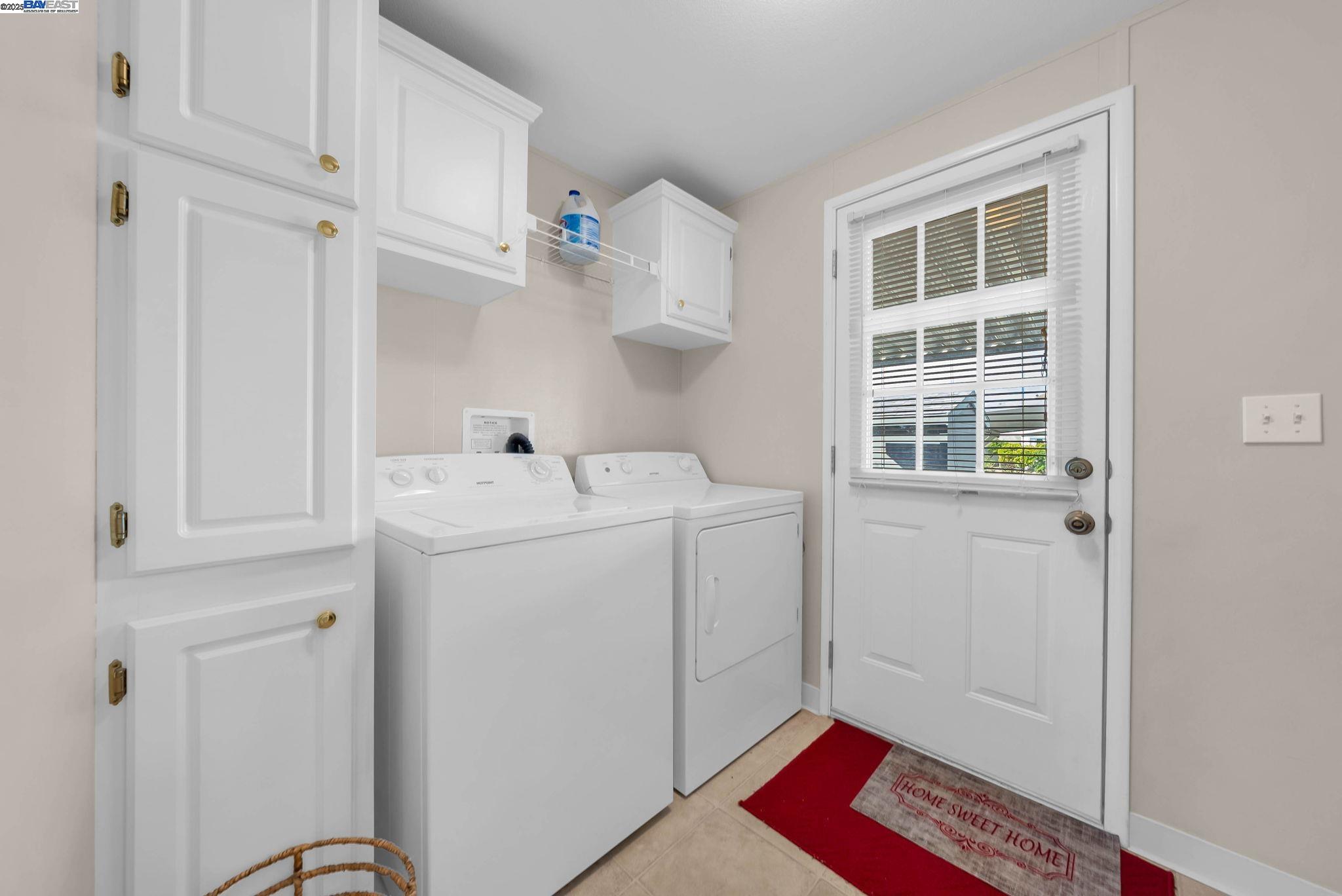 711 Old Canyon Road, Unit 176 Fremont, CA 94536 - Photo 29 of 41 a utility room with cabinets washer and dryer