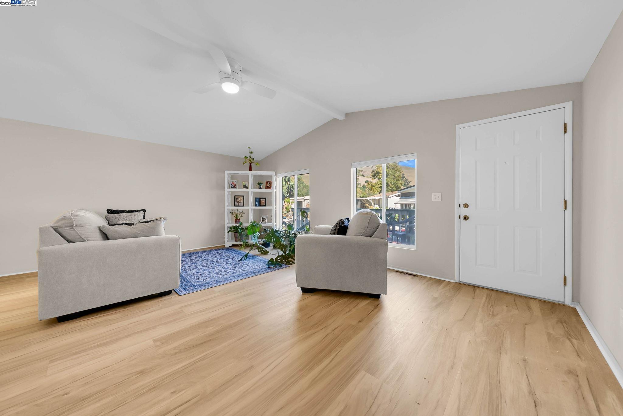 711 Old Canyon Road, Unit 176 Fremont, CA 94536 - Photo 5 of 41 a living room with furniture and wooden floor