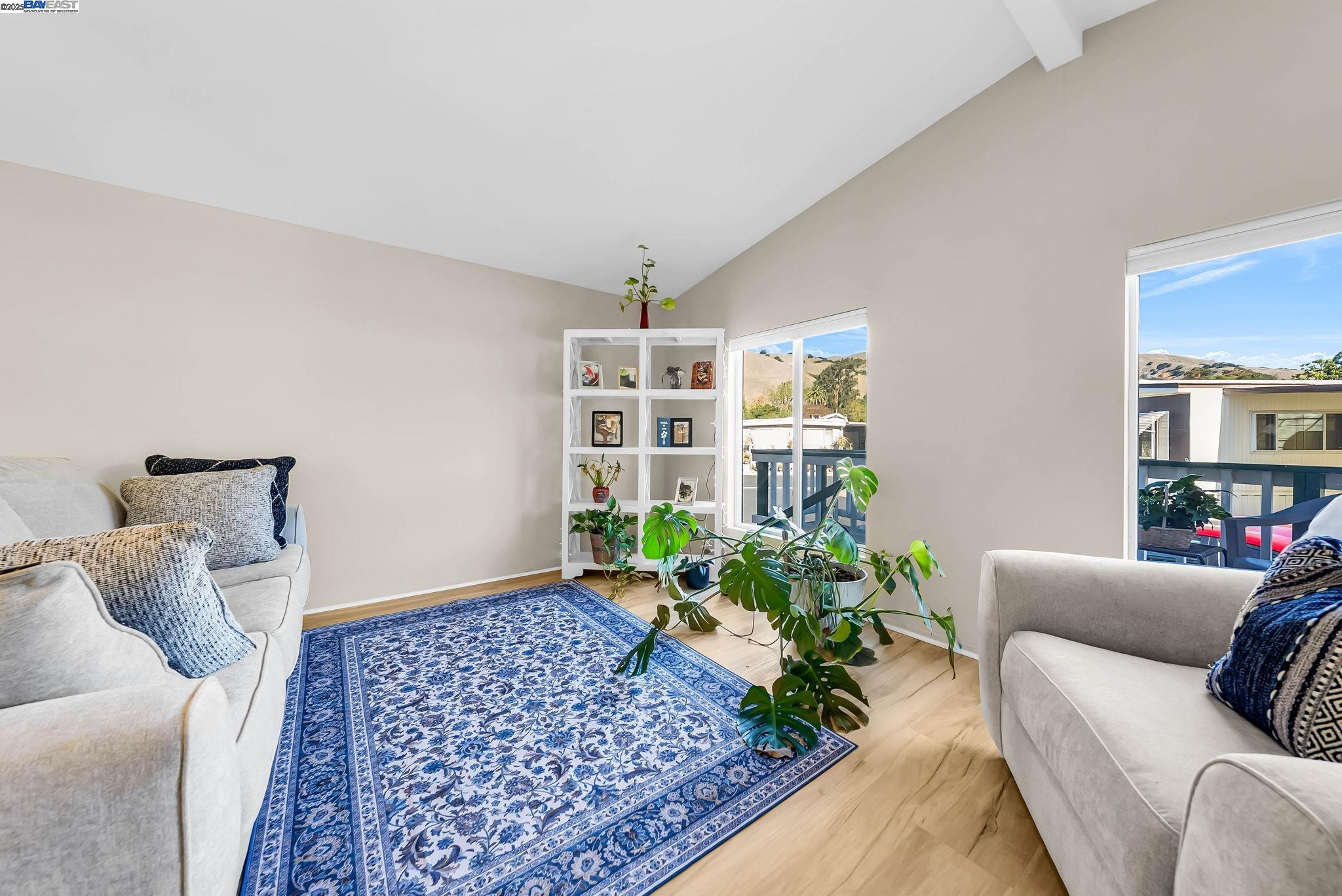 711 Old Canyon Road, Unit 176 Fremont, CA 94536 - Photo 6 of 41 a living room with furniture and a potted plant