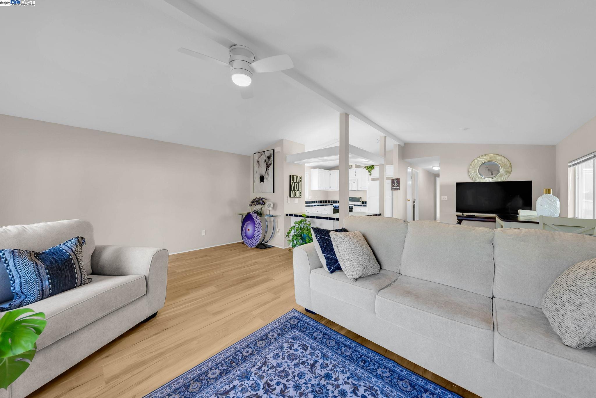 711 Old Canyon Road, Unit 176 Fremont, CA 94536 - Photo 7 of 41 a living room with furniture and a flat screen tv