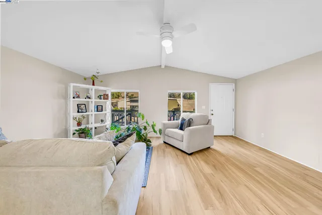 a view of a livingroom with furniture and a flat screen tv