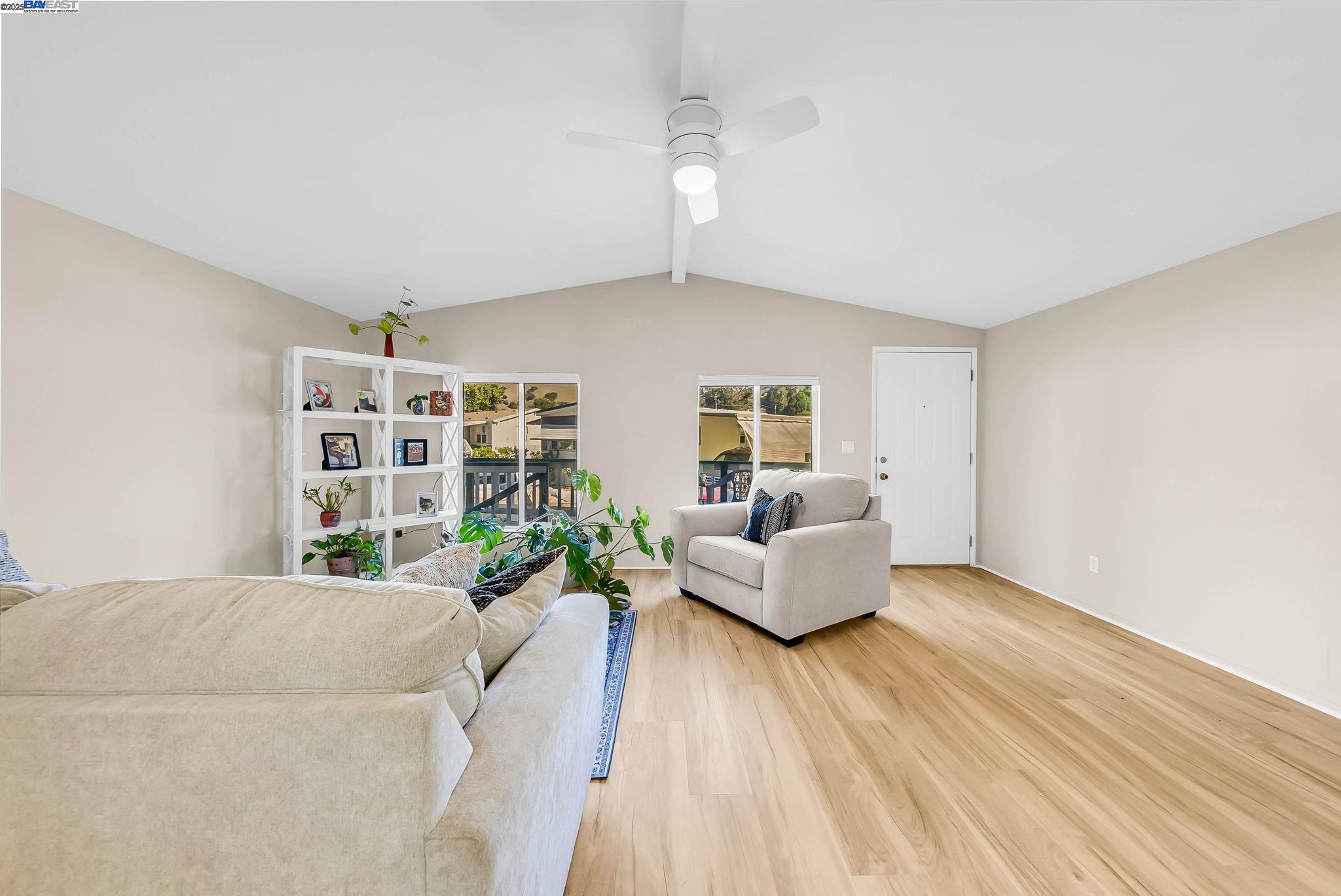 711 Old Canyon Road, Unit 176 Fremont, CA 94536 - Photo 9 of 41 a living room with furniture and wooden floor