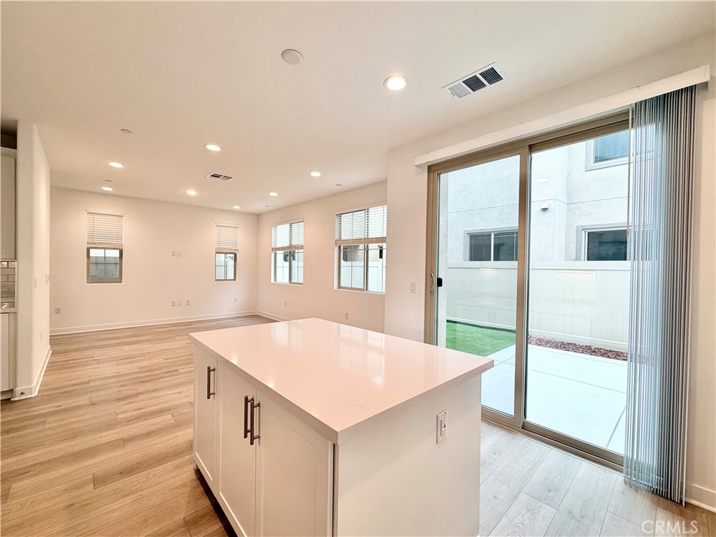 26893 Rubicon Road Menifee, CA 92586 - Photo 10 of 32 a kitchen with a sink and a refrigerator