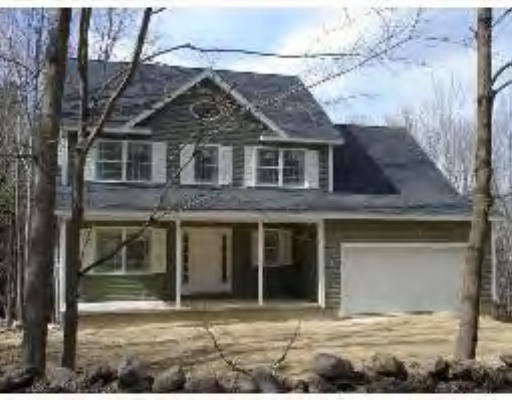 128 Dunham Road Warren, MA 01083 - Photo 1 of 5 a front view of a house with a yard