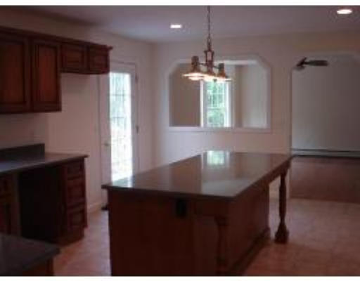 128 Dunham Road Warren, MA 01083 - Photo 4 of 5 a view of kitchen with kitchen island window and refrigerator