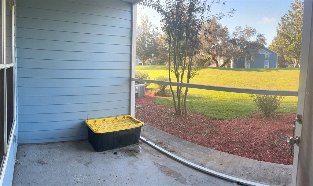 715 Sugar Bay Way, Unit 107 Lake Mary, FL 32746 - Photo 16 of 48 a view of a yard with a slide