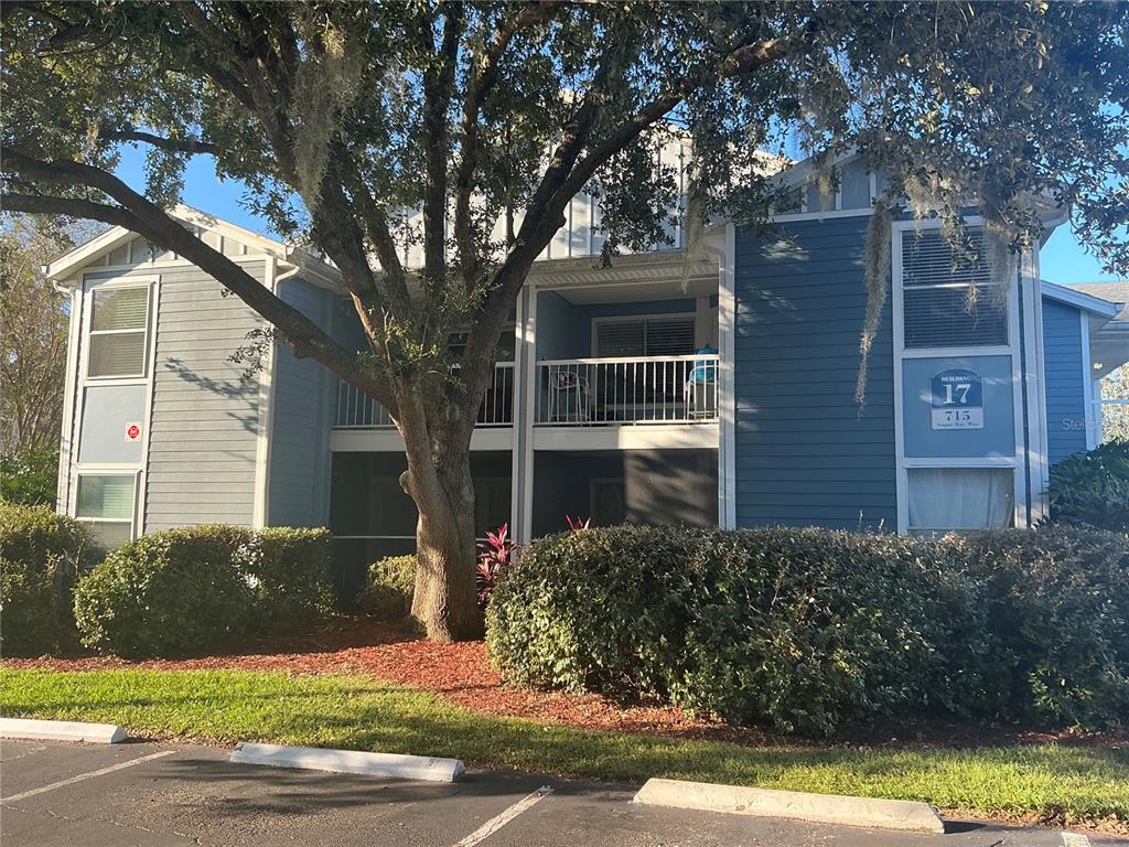 715 Sugar Bay Way, Unit 107 Lake Mary, FL 32746 - Photo 2 of 48 front view of a house with a yard