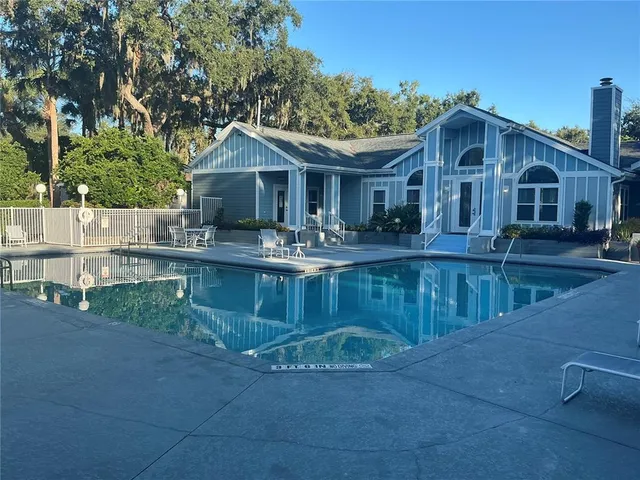 a view of a swimming pool with a patio