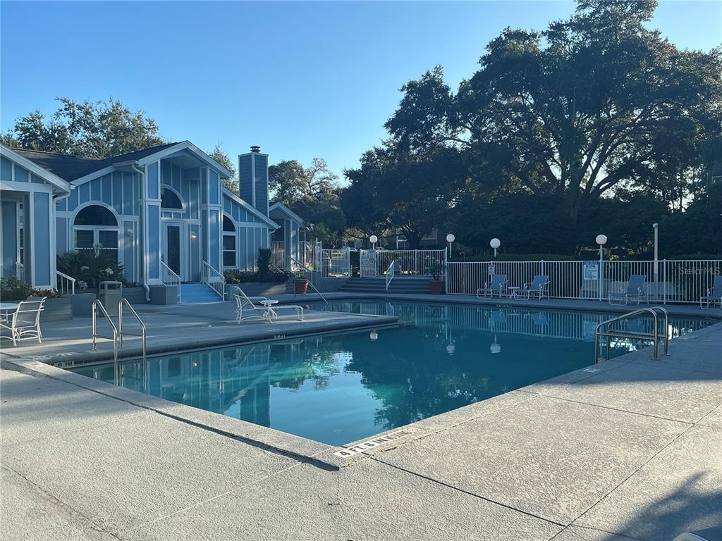 715 Sugar Bay Way, Unit 107 Lake Mary, FL 32746 - Photo 24 of 48 a view of a swimming pool with a patio